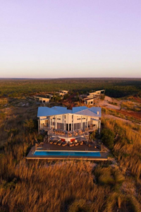 Aerial view of Berkeley River Lodge, its pool and villas surrounded by Kimberley wilderness