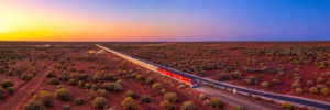 The Ghan train crossing the red Australian outback