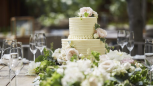 Beautiful, elegant, wedding cake with floral decorations on table